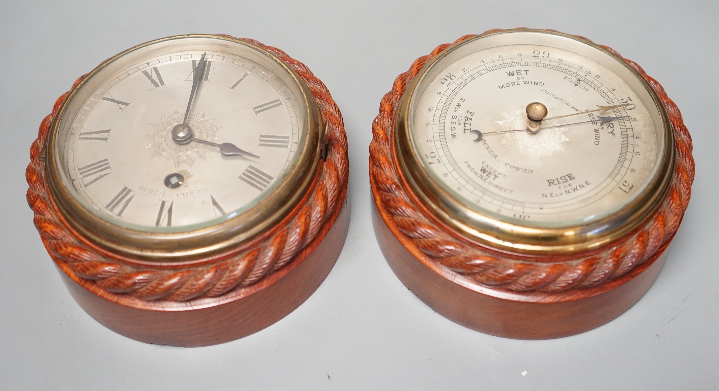 A Victorian teak cased bulkhead timepiece by Benzie, Cowes, Isle of Wight with matching aneroid barometer, both with carved rope twist cases, 15cm. diam.